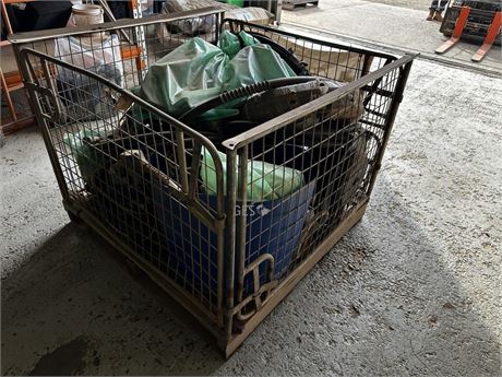 Fuel hand pumps and hoses in pallet cage